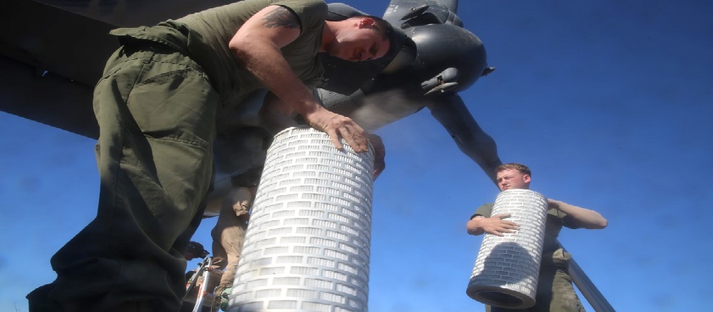 Guys carrying air filters